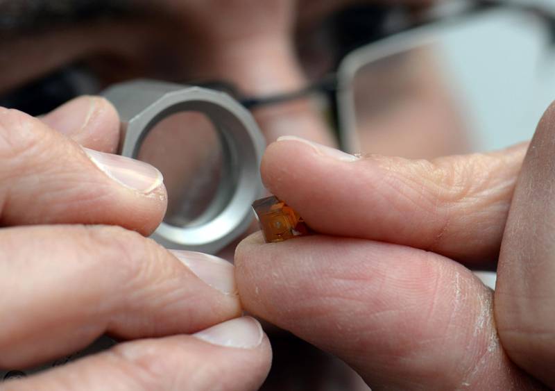 Bernd Mildenberger, manager of the company Medidia, checks a synthetic diamond with a magnifying glass in Idar-Oberstein, Germany, 25 September 2017. The company specialises in diamond tools for industry, research and medical technology. Photo by: Harald Tittel/picture-alliance/dpa/AP Images