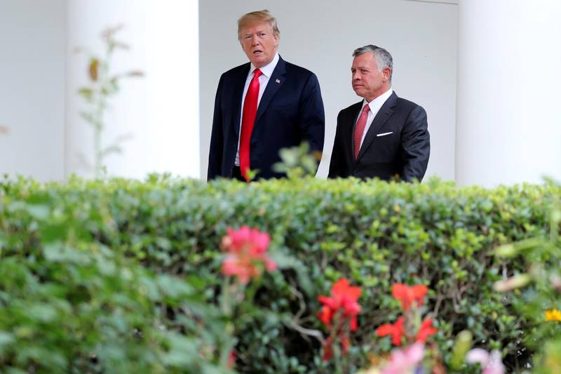 U.S. President Donald Trump talks with Jordan’s King Abdullah as he walks with the King down the West Wing colonnade while welcoming the King to the White House in Washington, U.S., June 25, 2018. REUTERS/Jonathan Ernst