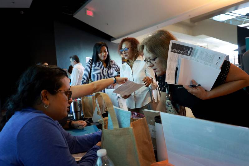 Recruiters and jobseekers at a job fair in Sunrise, Florida. While an increasing number of Americans can now secure jobs, the Federal Reserve is more worried about inflation and is aggressively attempting to bring it down. AFP