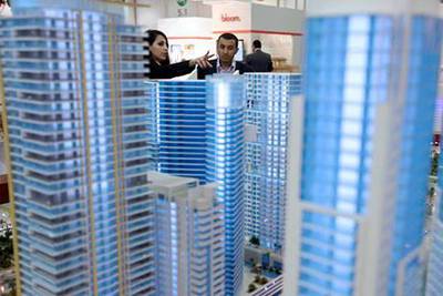 April 19, 2011 (Abu Dhabi )Mohamed El Fayouny, is shown a model from a Eshraq representative at City Scape in Abu Dhabi April 19, 2011 (Sammy Dallal / The National)