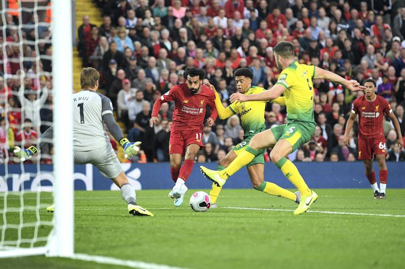 LIVERPOOL, ENGLAND - AUGUST 09: Mohamed Salah of Liverpool scores his sides second goal during the Premier League match between Liverpool FC and Norwich City at Anfield on August 09, 2019 in Liverpool, United Kingdom. (Photo by Michael Regan/Getty Images)