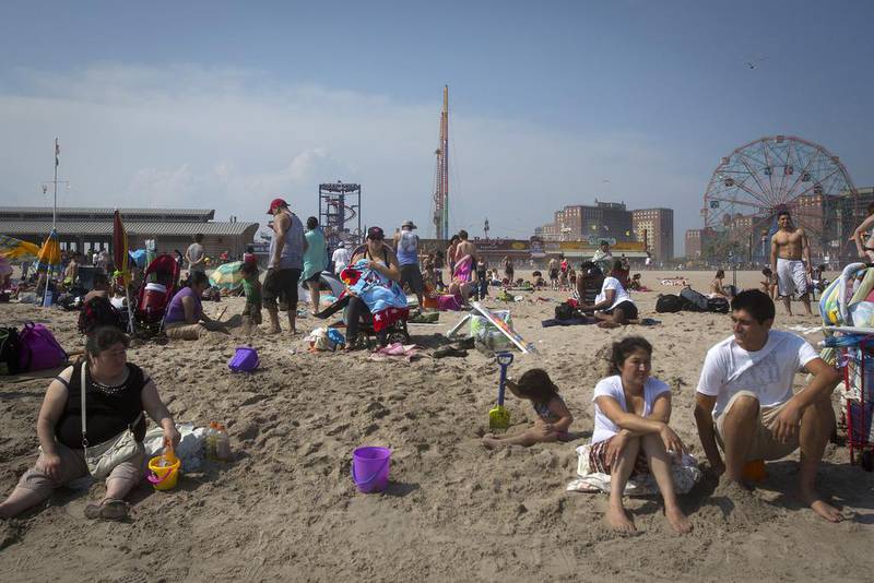 A sunny day out for beachgoers on Coney Island in Brooklyn, New York. Suketu Mehta is writing a book about the immigrant experience in the Big Apple, tentatively titled City of the Second Chance. Carlo Allegri / Reuters