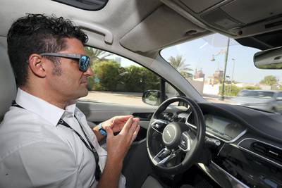 Dubai, United Arab Emirates - October 15, 2019: A Jaguar I Pace autonomous vehicle driven by Jim O'Donoghue, lead research engineer takes people on a drive to show driverless cars at work at the Dubai World Congress for Self-Driving Transport. Tuesday the 15th of October 2019. World Trade centre, Dubai. Chris Whiteoak / The National