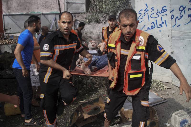 The Palestinian Civil Defence evacuate a wounded man following an explosion in Jebaliya refugee camp, northern Gaza Strip. AP 