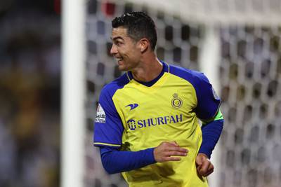Al Nassr's Portuguese forward Cristiano Ronaldo celebrates scoring his team's second goal against Al Wehda in the Saudi Pro League match at the King Abdulaziz Stadium in Makkah on February 9, 2023. Ronaldo bagged all four goals in a 4-0 win. AFP