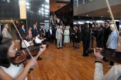 Prince Charles, accompanied by his wife Camilla, Duchess of Cornwall, are greeted by officials and a children's quartet as they arrive at the Bibliotheca Alexandrina in Egypt's northern Mediterranean coastal city of Alexandria. AFP