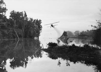 FOR MALARIA / SMALPOX GALLERY. 2nd March 1945:  An American army plane spreading insecticide on a stream to destroy mosquitos which carry malaria.  (Photo by Keystone Features/Getty Images)
