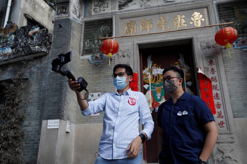 Paul Chan, tour guide and chief executive of Walk in Hong Kong, and Charles Lai, architect, speak during a live streamed virtual tour, following the coronavirus outbreak in Hong Kong, China. Reuters