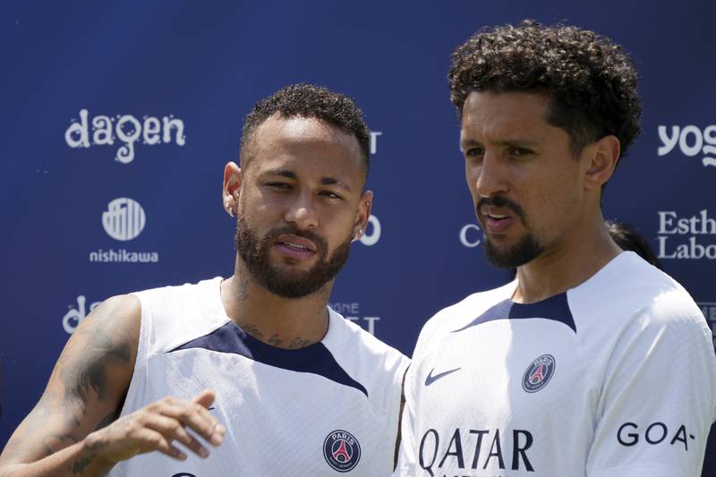 Paris Saint-Germain players, Neymar, left, and Marquinhos, before a group photo taken during a PSG soccer lesson Monday, July 18, 2022, in Tokyo. AP Photo
