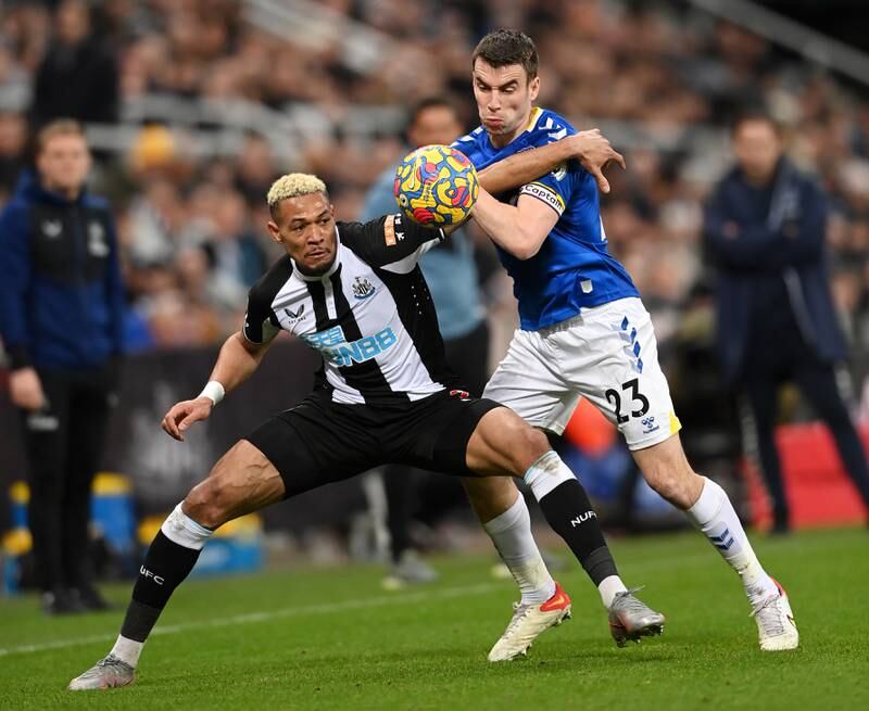 Newcastle midfielder Joelinton is challenged by Seamus Coleman of Everton. Getty