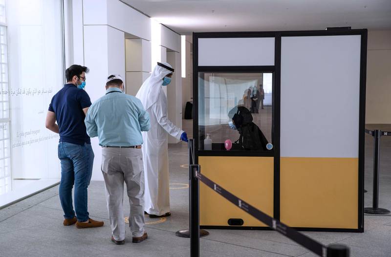 Abu Dhabi, United Arab Emirates, June 25, 2020.     Visitors have their tickets  scanned before entering the Louvre , Abu Dhabi, after 100 days of being temporarily closed due to the Covid-19 pandemic.Victor Besa  / The NationalSection:  NAReporter:  Saeed Saeed