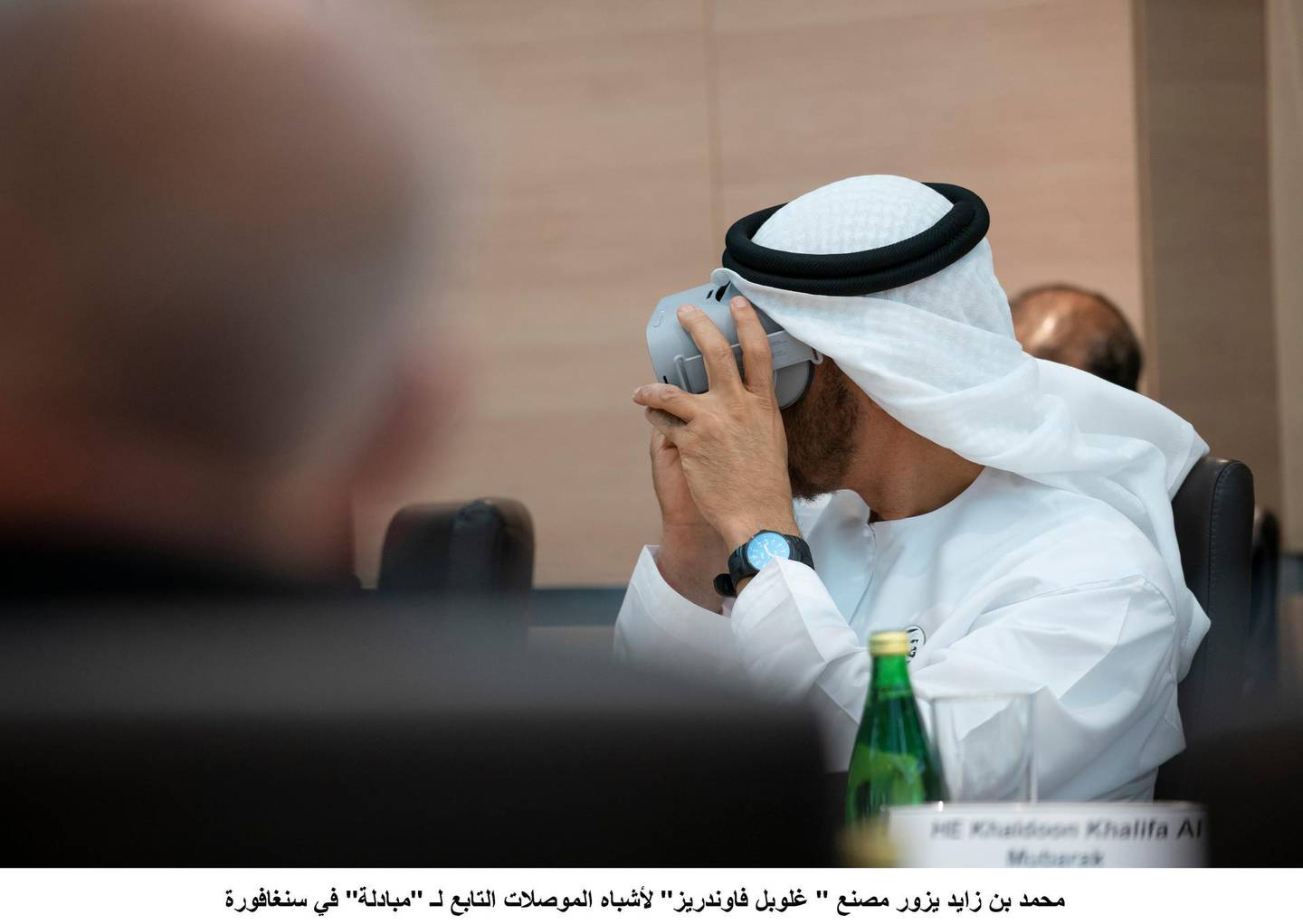 SINGAPORE, SINGAPORE - February 28, 2019: HH Sheikh Mohamed bin Zayed Al Nahyan, Crown Prince of Abu Dhabi and Deputy Supreme Commander of the UAE Armed Forces (L), looks through a virtual reality goggles, during a meeting, at Mubadala's GLOBALFOUNDRIES semiconductor facility.( Ryan Carter for the Ministry of Presidential Affairs )---