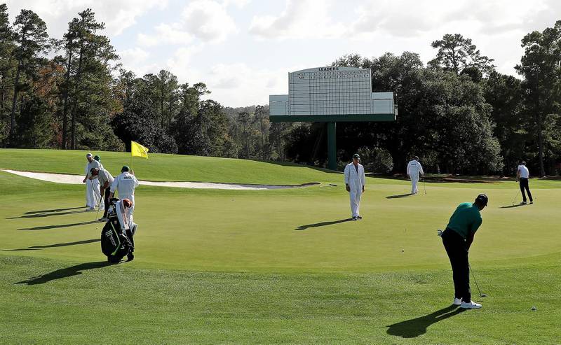 Tiger Woods putts on the 18th green during a practice round prior to the Masters at Augusta National Golf Club. AFP
