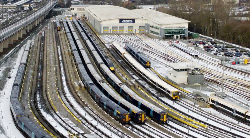 Southeastern trains are parked in sidings near Ashford Station in Kent. PA