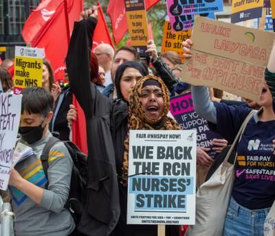 Striking health workers marched from St Thomas's Hospital to Trafalgar Square in London on Monday. EPA