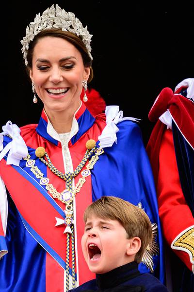 Kate smiles as Prince Louis shouts as they wait for the Royal Air Force fly-past. AFP