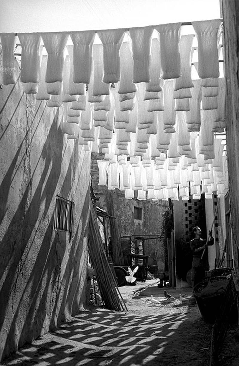 Skeins of cotton hanging to dry in dyers souk, Tunis, Tunisia, 1958. Photo: George Rodger