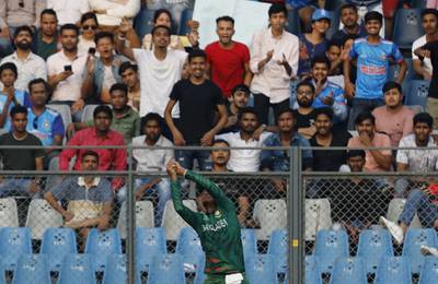 Bangladesh's Nasum Ahmed takes a catch to dismiss South Africa's Quinton de Kock off the bowling of Hasan Mahmud. Reuters