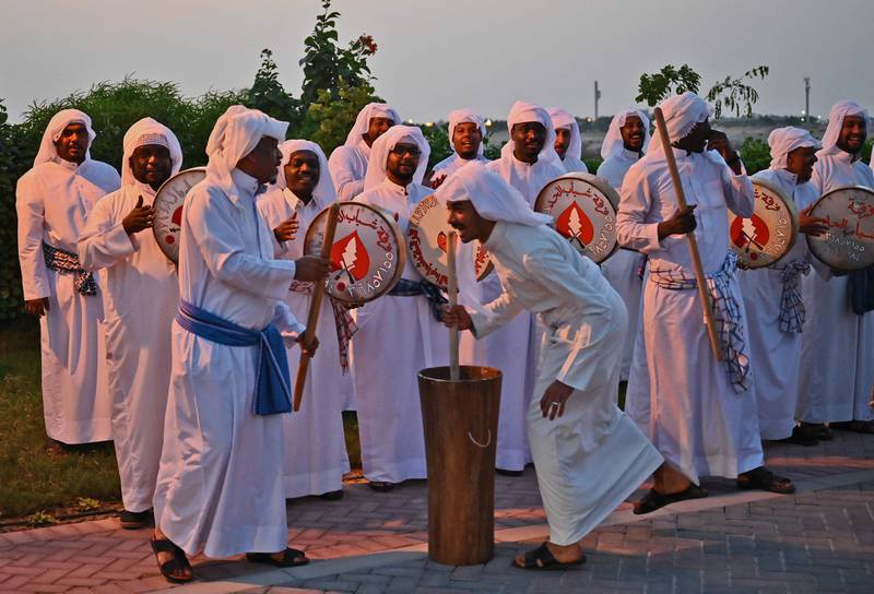 A band performs traditional music on the road between the airport and the Royal Palace in Manama.  AFP