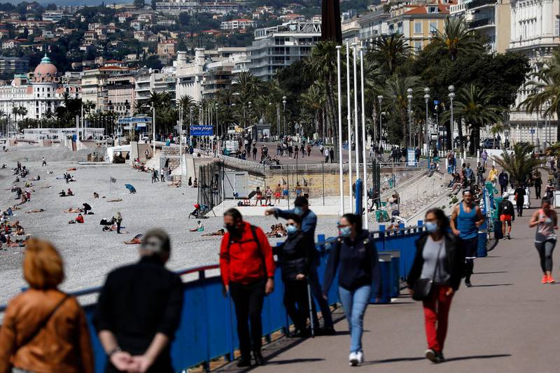 People walk on the Promenade des Anglais in Nice, France. French authorities on May 3 began a gradual easing of some lockdown measures. EPA