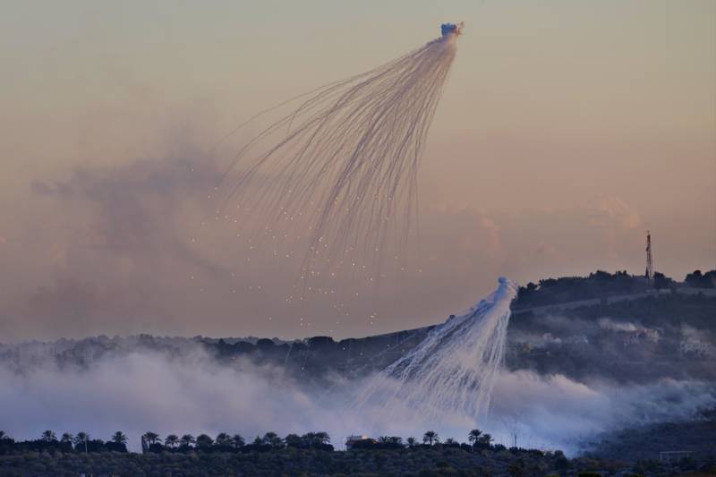 Shells that appear to contain white phosphorus from Israeli artillery explode over Dahaira, a Lebanese village that borders Israel. AP