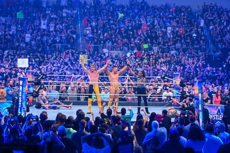 Logan Paul and The Miz celebrate their tag team win at WrestleMania 38.
