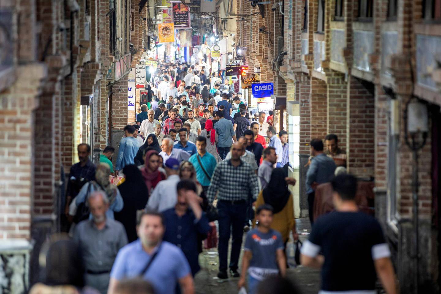 FILE PHOTO: People shop in a shopping street called Grand Bazaar in downtown Tehran, Iran June 23, 2019.  Nazanin Tabatabaee/Wana News agency/via REUTERS. ATTENTION EDITORS - THIS PICTURE WAS PROVIDED BY A THIRD PARTY/File Photo