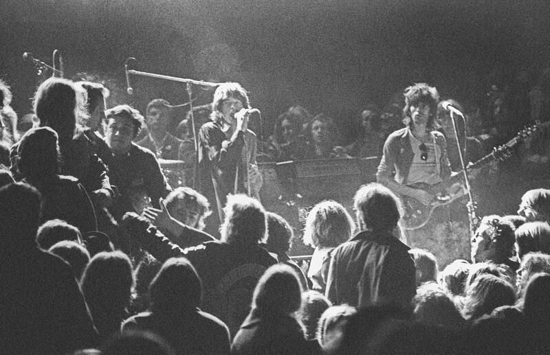 LIVERMORE, CA - DECEMBER 6: Mick Jagger and Keith Richards of the Rolling Stones warily eye the Hells Angels onstage at The Altamont Speedway on December 6, 1969 in Livermore, California. (Photo by Robert Altman/Michael Ochs Archives/Getty Images) *** Local Caption *** Mick Jagger;Keith Richards