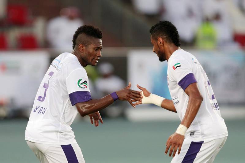 Asamoah Gyan of Al Ain , left, celebrates scoring against Al Ahli with Mohamed Ahmad during the President's Cup final on Sunday. Christopher Pike / The National / May 18, 2014