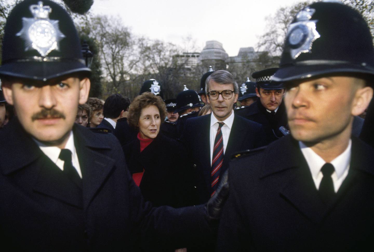 John Major and his wife Norma stroll through St James Park surrounded by Metropolitan police officers during the November 1990 election campaign when he was elected British prime minister. Getty Images