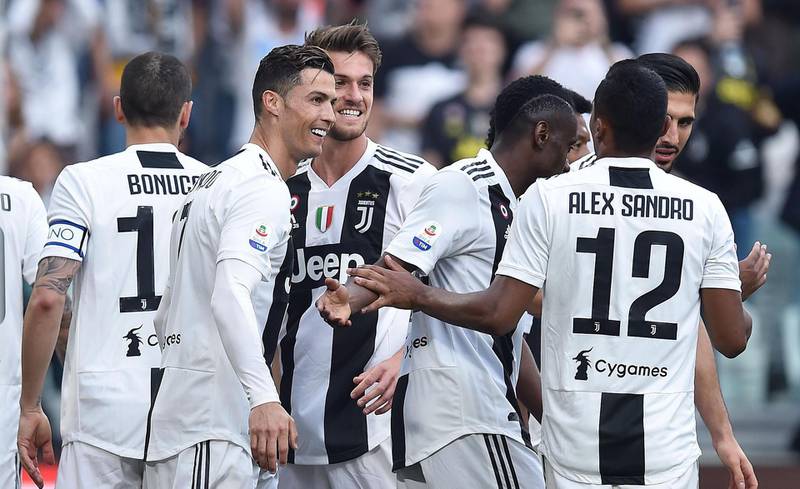 Cristiano Ronaldo celebrates with teammates after his shot caused the own goal to give Juventus a 2-1 lead against Fiorentina. EPA