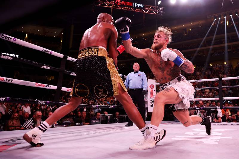 Jake Paul punches Anderson Silva during their cruiserweight bout at Gila River Arena. AFP