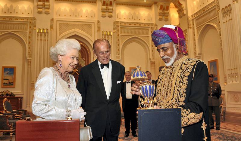 MUSCAT, OMAN - NOVEMBER 26:  Queen Elizabeth II and Prince Philip, Duke of Edinburgh are presented with a gold musical Faberge style egg by the Sultan of Oman, before a State Banquet at his Palace  on November 26, 2010 in Muscat, Oman. The Queen and Duke of Edinburgh formally begins the second leg of her Gulf state visit. The Royal couple have spent two days in Abu Dhabi and will spend three days in Oman. (Photo by John Stillwell -  Pool/Getty Images)