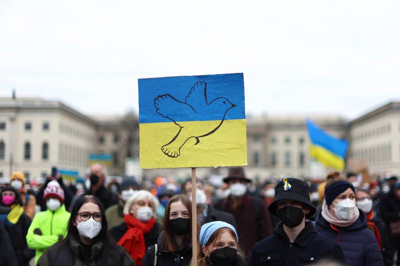 A placard in the Ukrainian colours is held up at an anti-war demonstration the Bebelplatz square in Berlin, Germany. Reuters