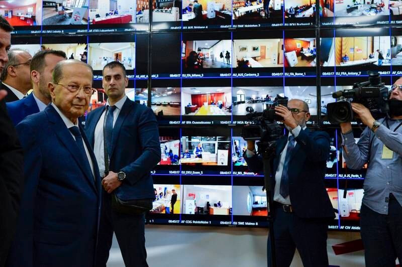 Lebanese President Michel Aoun visits the operation room to observe the voting process through screens at the Ministry of Foreign Affairs in downtown Beirut. EPA 