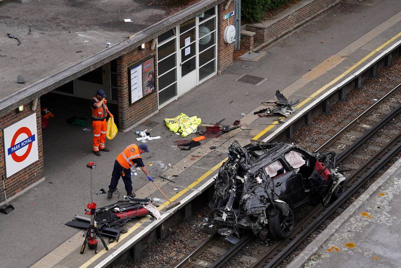 The wreckage of a Range Rover that veered off the road onto the Piccadilly Line train track after colliding with a Tesla, at Park Royal Station, in West London. A woman, 33, was killed in the crash. Reuters