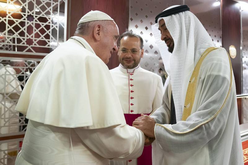 ABU DHABI, UNITED ARAB EMIRATES - February 03, 2019: Day one of the UAE papal visit - HH Sheikh Mohamed bin Zayed Al Nahyan, Crown Prince of Abu Dhabi and Deputy Supreme Commander of the UAE Armed Forces (R), receives His Holiness Pope Francis, Head of the Catholic Church (L), at the Presidential Airport. 

( Mohamed Al Hammadi / Ministry of Presidential Affairs )
---