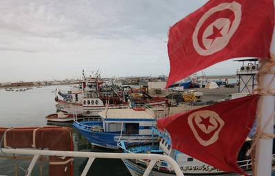 Tunisian fishing boat are pictured at the port of Zarzis in the southern coast of Tunisia on May 21, 2019. Tunisian fishermen are finding themselves more and more involved in rescuing illegal boats leaving Libya for Italy, due to the difficulties of NGOs in the eastern Mediterranean and the disengagement of European military ships. Most of the fishermen have already brought back migrants - saving hundreds of lives over the years. / AFP / FATHI NASRI
