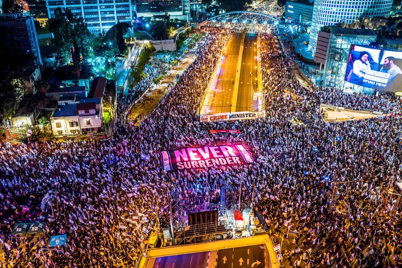 An aerial view shows people protesting as Israeli Prime Minister Benjamin Netanyahu's nationalist coalition government presses on with its contentious judicial overhaul, in Tel Aviv, Israel, March 18, 2023. Reuters