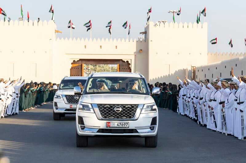 Sheikh Mohamed and Sheikh Mansour bin Zayed, Deputy Prime Minister and Minister of the Presidential Court arrive at the Sheikh Zayed Heritage Festival to attend the Union Parade. Ryan Carter / Presidential Court 