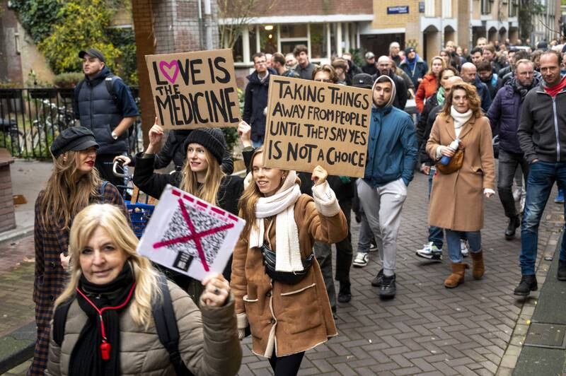 Protesters in the Dutch capital of Amsterdam respond to restrictions announced by the government to curb the spread of the coronavirus pandemic. EPA