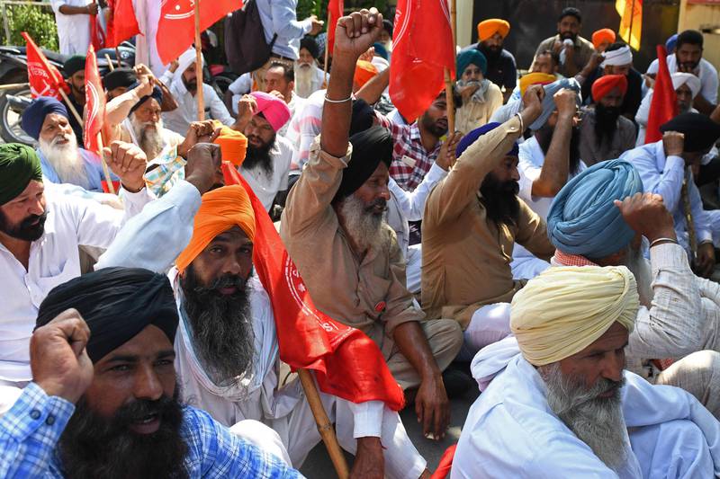 Farmers shout slogans during a protest in Amritsar on October 2. Photo: AFP