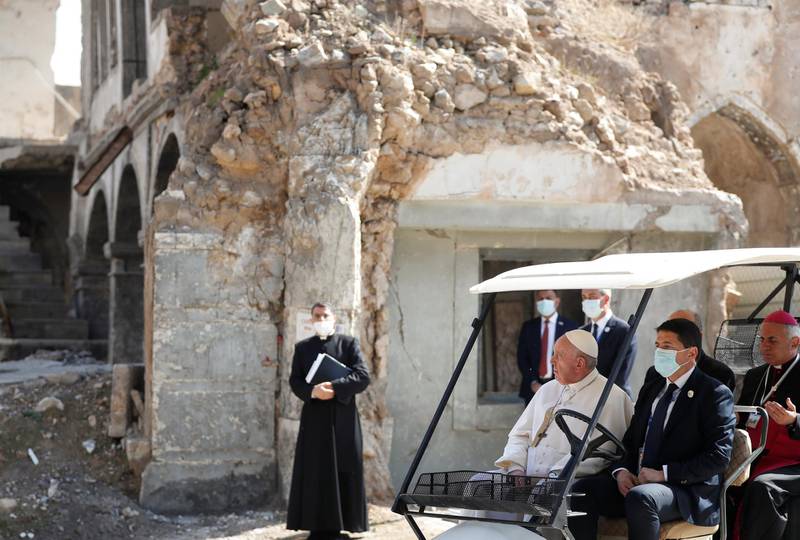 Pope Francis holds a minute of silence at the destroyed cathedral in Mosul's old city. Reuters