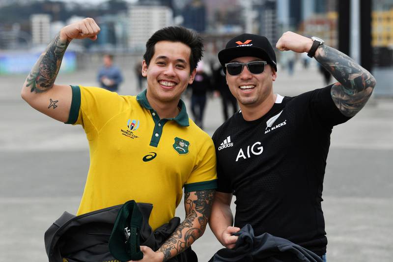 Rival fans pose for a photo as they arrive at the stadium ahead of during the Bledisloe Cup rugby game between the All Blacks and the Wallabies in Wellington, New Zealand. AP Photo
