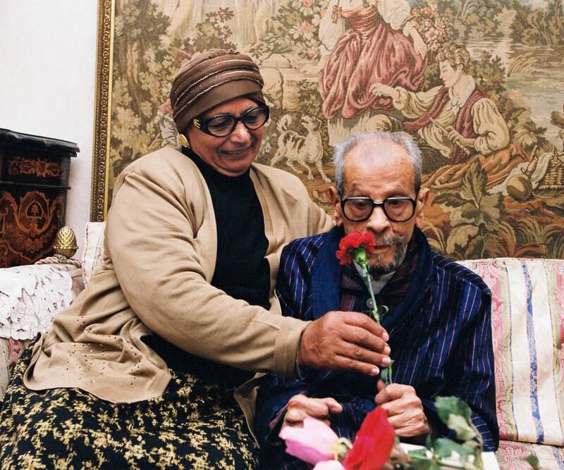 In this photo taken in December 2001, Naguib Mahfouz’s wife Attiyat-Allah gives him a flower for his birthday. Photo: Mohamed Hegazy