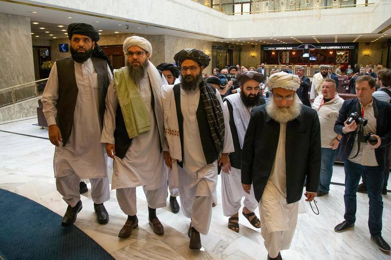 FILE - In this May 28, 2019 file photo, Mullah Abdul Ghani Baradar, the Taliban group's top political leader, third from left, arrives with other members of the Taliban delegation for talks in Moscow, Russia. U.S. envoy Zalmay Khalilzad and the Taliban have resumed negotiations on ending Americaâ€™s longest war. A Taliban member said Khalilzad also had a one-on-one meeting on Wednesday, Aug. 21, 2019, with  Baradar, the Talibanâ€™s lead negotiator, in Qatar, where the insurgent group has a political office. (AP Photo/Alexander Zemlianichenko, File)