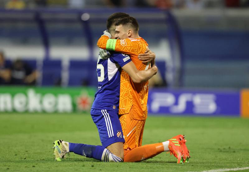 Dinamo Zagreb's Dino Peric celebrates with Dominik Livakovic after the 1-0 Champions League victory against Chelsea on September 6, which turned out to be Thomas Tuchel's last match as manager. Reuters