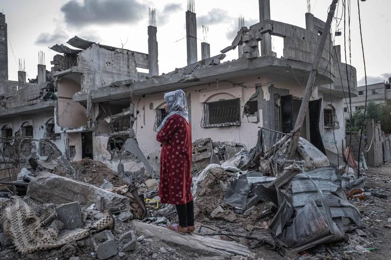 A Palestinian woman looks at the rubble of destroyed homes in Beit Hanoun, northern Gaza, on May 22, 2021. Getty