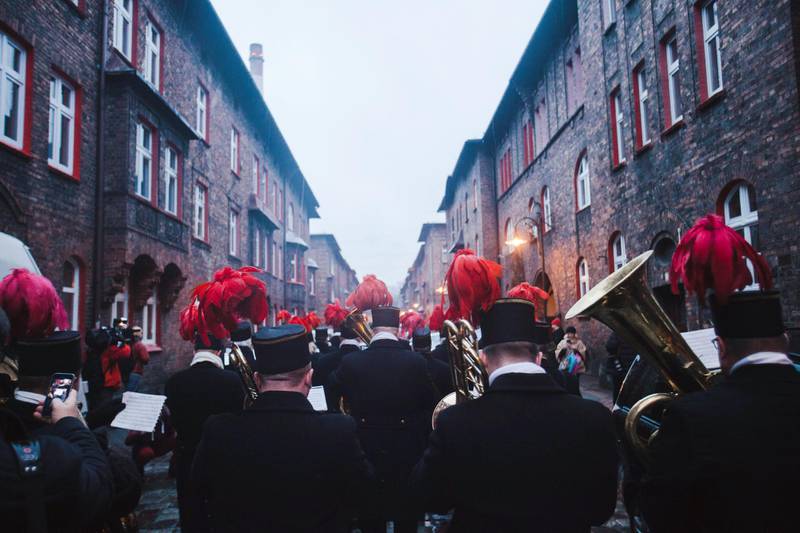 The orchestra comprised of miners from Nikiszowiec march through the town as dusk breaks on St Barbara's day - the Patron saint of mining. Rafal Wojczal for The National