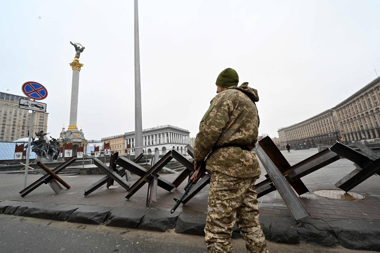 A fighter of the Ukrainian Territorial Defence Forces stands guard at Independence Square in Kiev. AFP